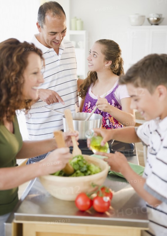 Hispanic family preparing dinner together