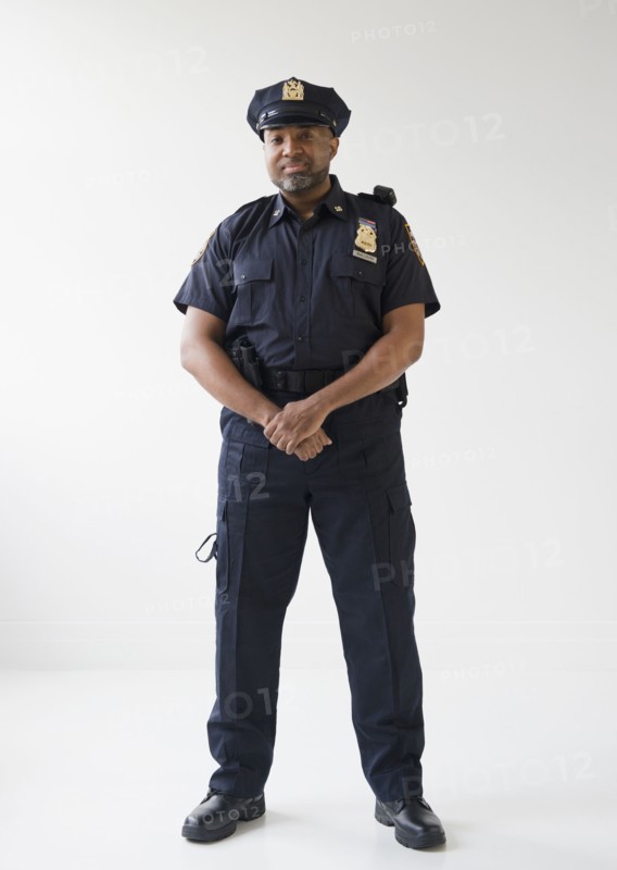 African American policeman with hands clasped