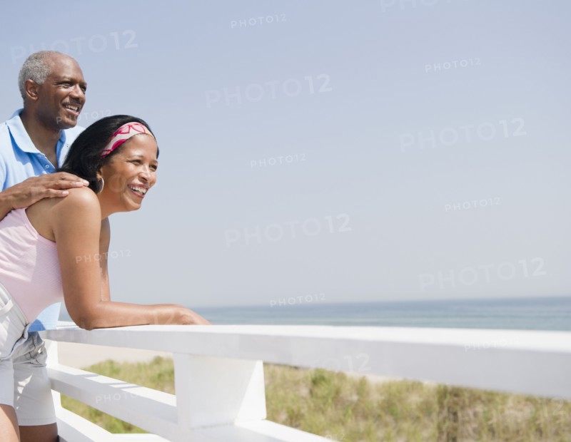 Black couple enjoying beach together