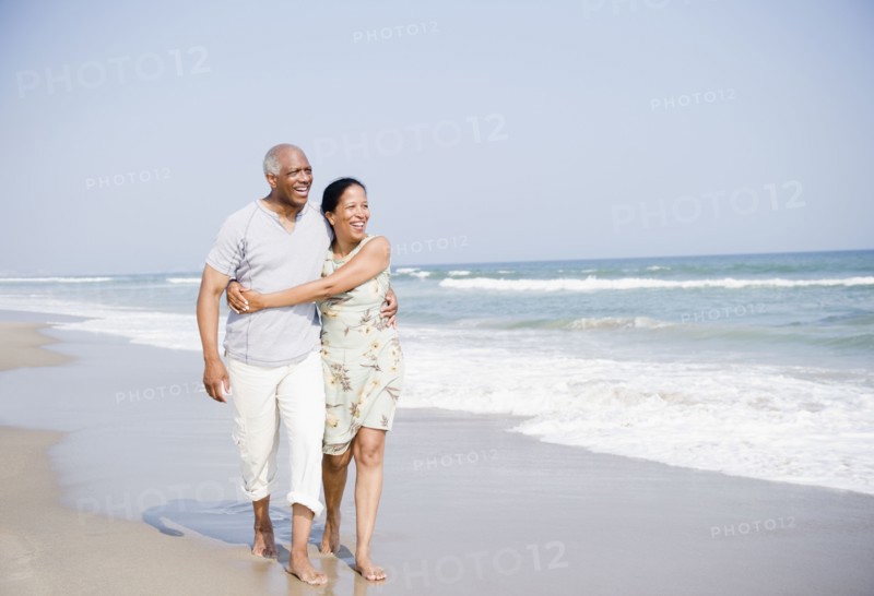 Black couple enjoying beach together