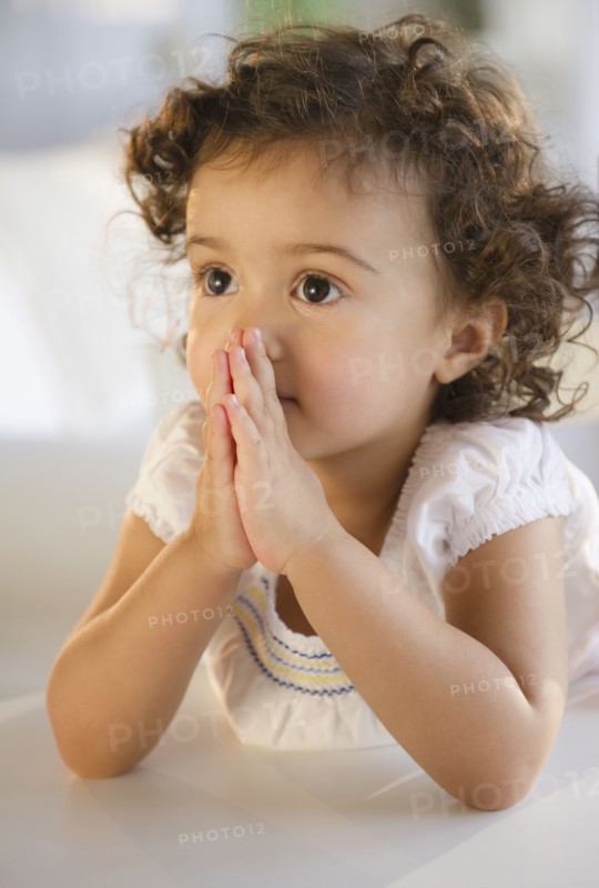 Mixed race girl praying