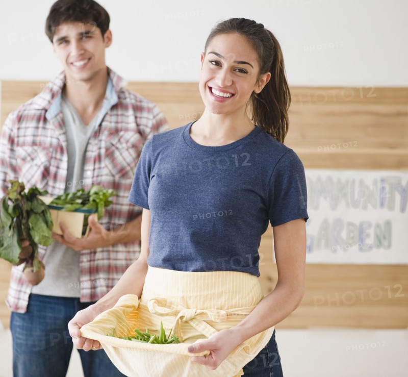 Couple carrying vegetables together