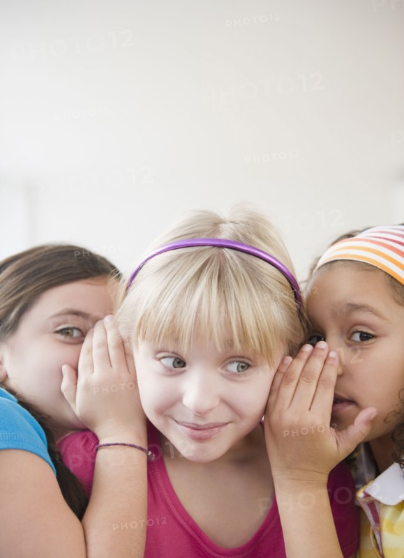 Girls whispering together