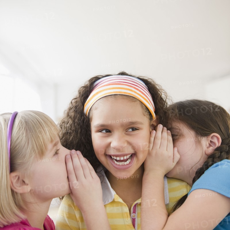 Girls whispering together