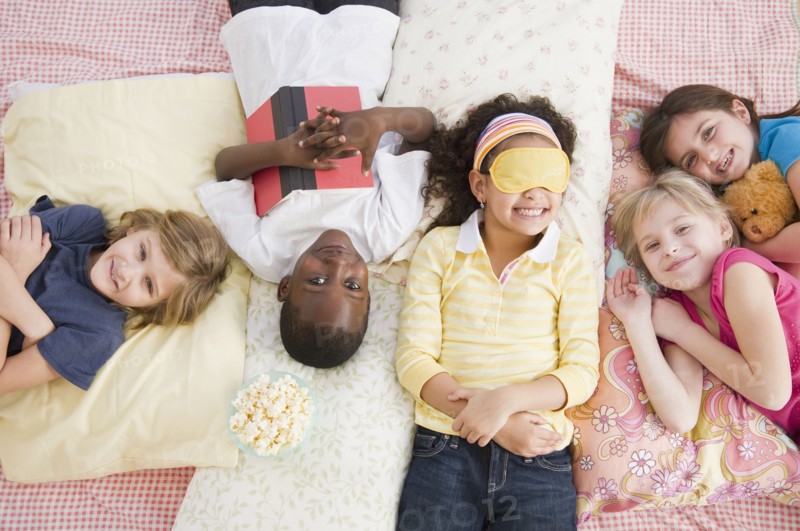 Children having slumber party together