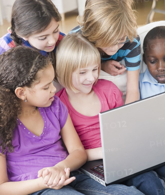 Friends using laptop together