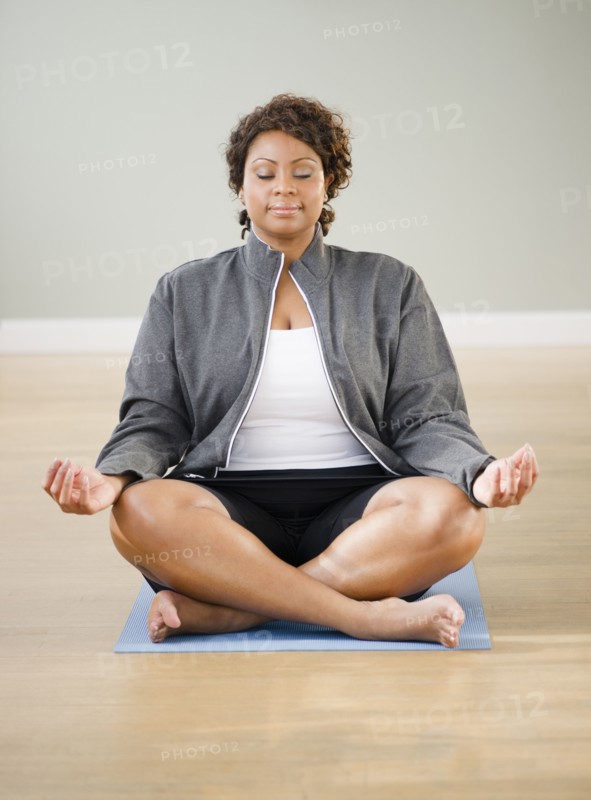 African American woman practicing yoga
