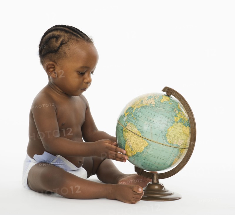 African American baby looking at globe