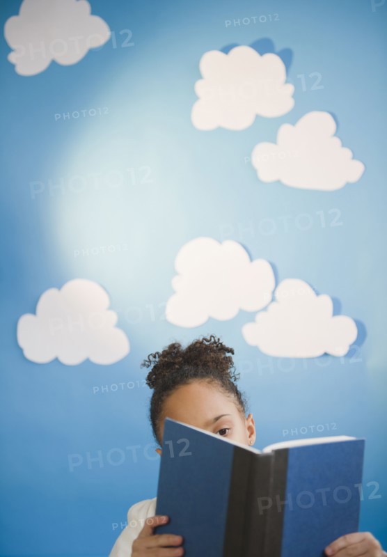 African American girl reading book