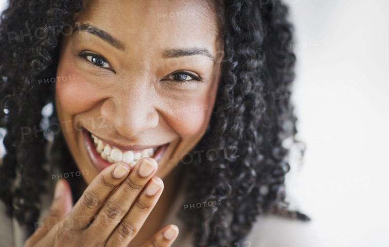 Laughing mixed race woman