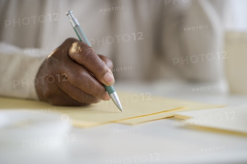 Black woman writing letter