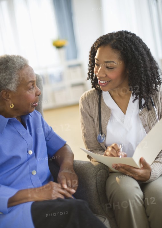 Nurse giving woman checkup
