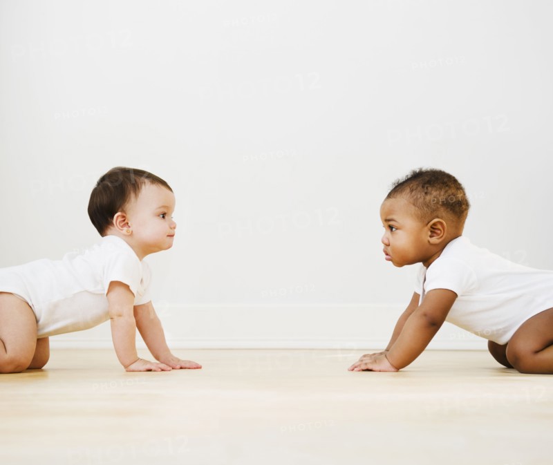 Babies crawling on floor