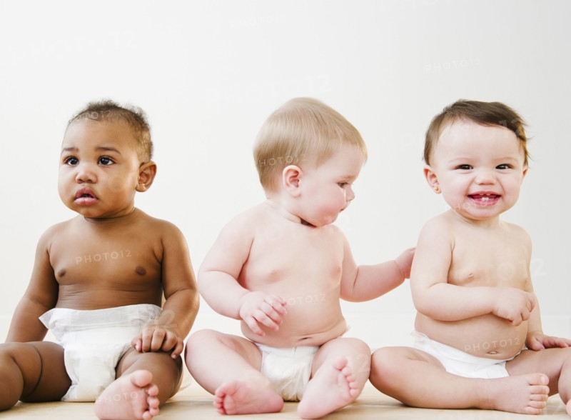 Babies sitting together on floor