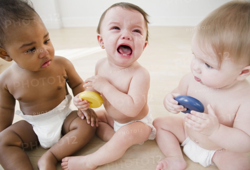 Babies watching crying friend