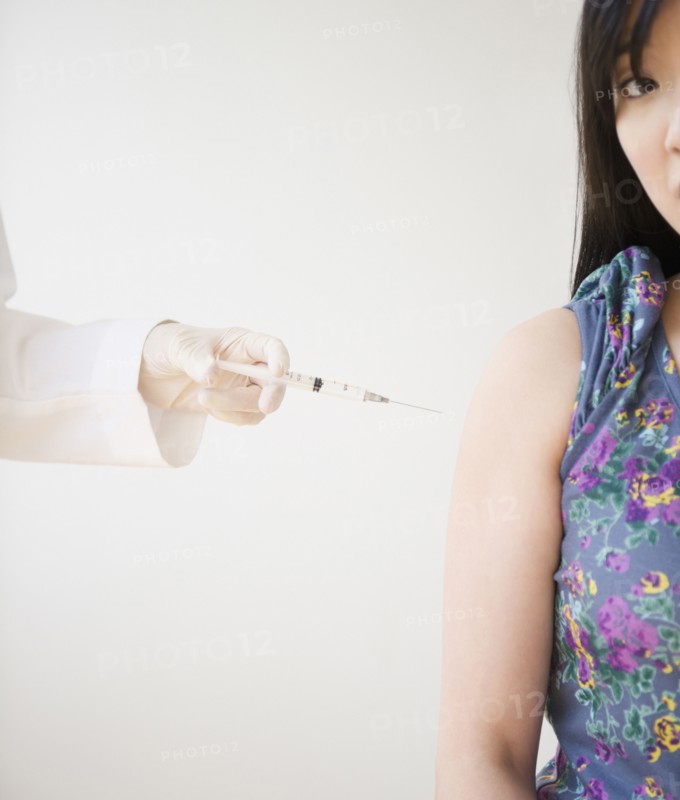 Korean woman receiving injection