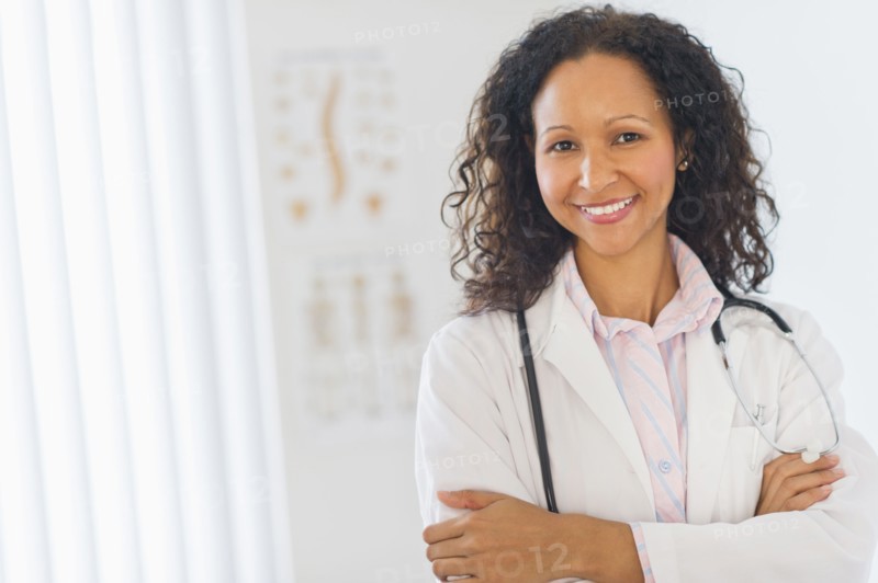 Hispanic doctor standing in hospital