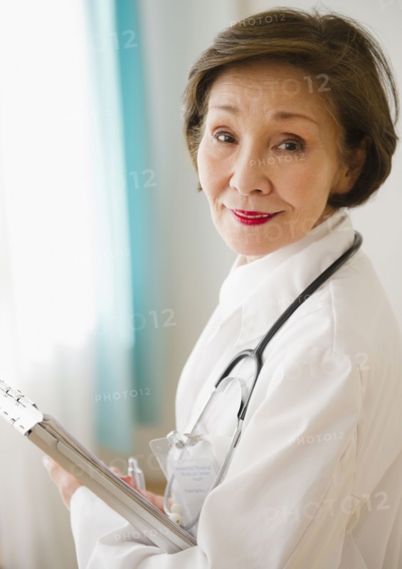 Japanese doctor holding medical chart