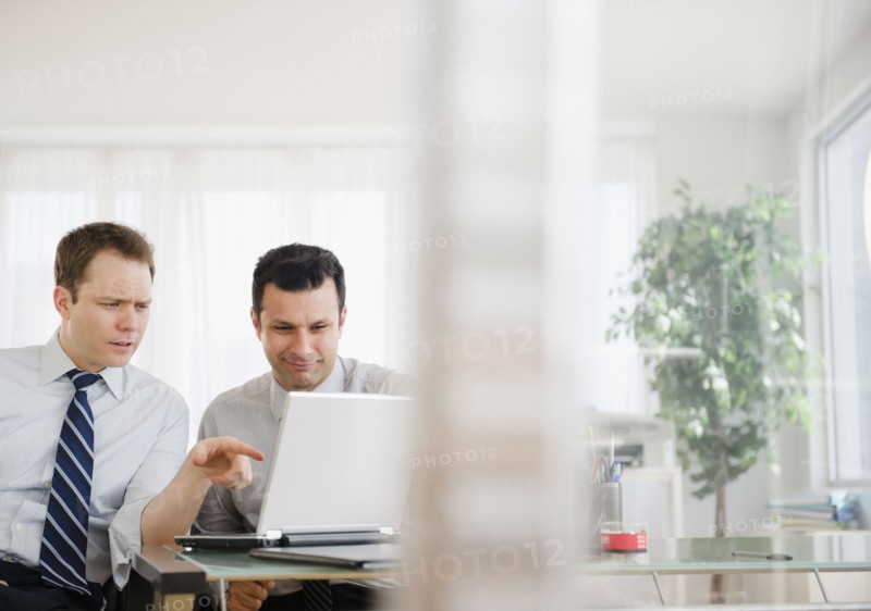 Businessmen working together in office