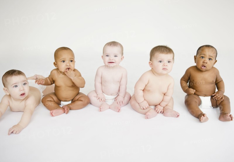 Babies sitting together on floor