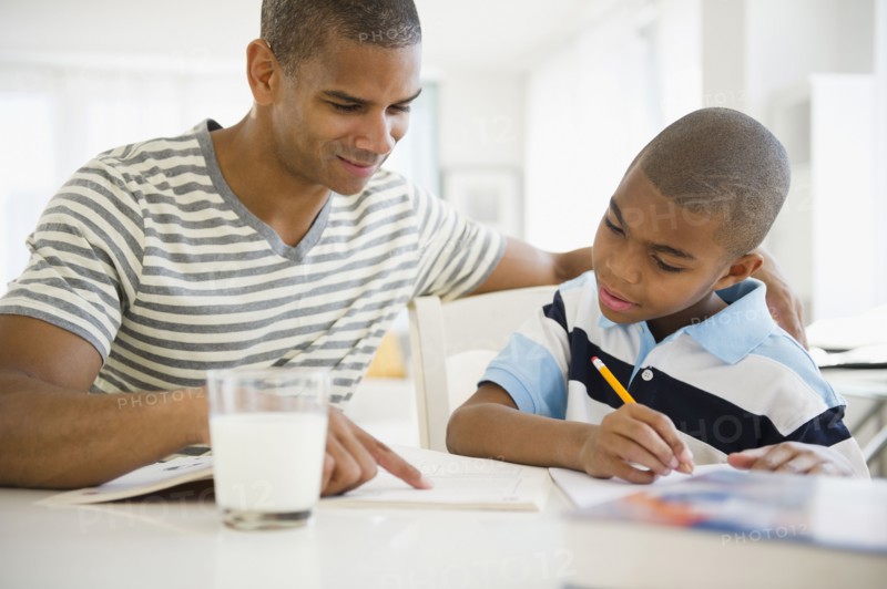Father helping son with homework
