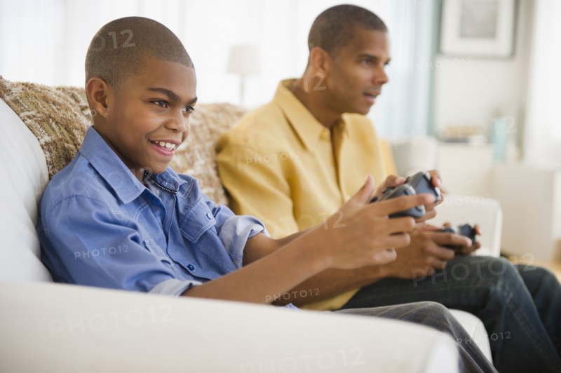 Father and son playing video games