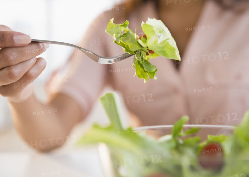 Cape Verdean woman eating salad