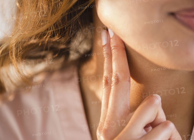 Cape Verdean woman feeling her pulse