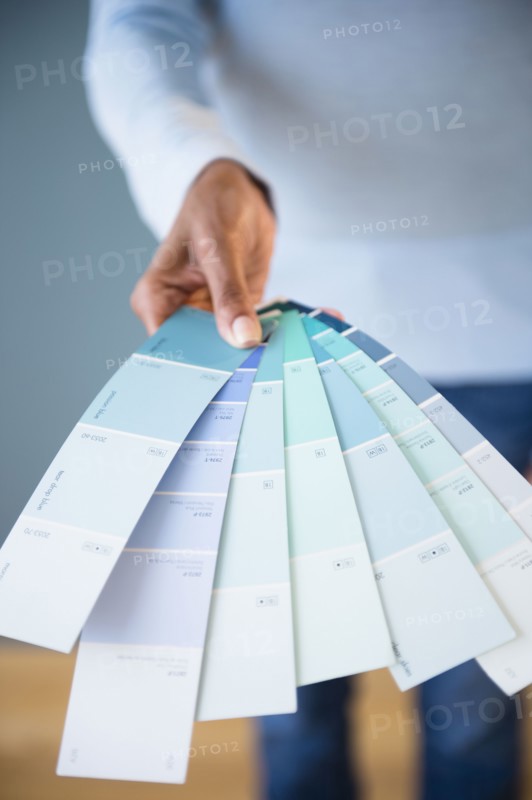 Cape Verdean woman holding color swatches