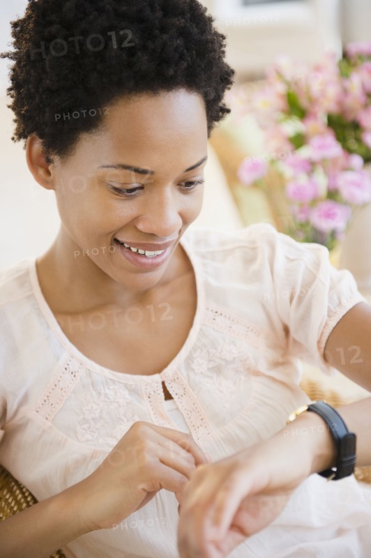 African American woman checking the time