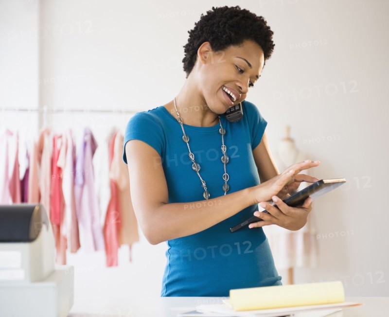 African American woman using a digital tablet at work