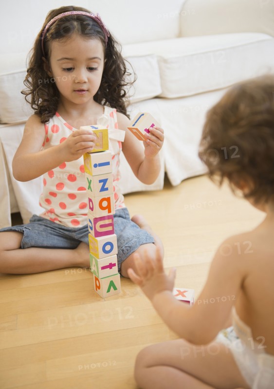 Mixed race children playing with blocks