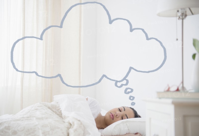 Hispanic woman sleeping with empty thought bubble