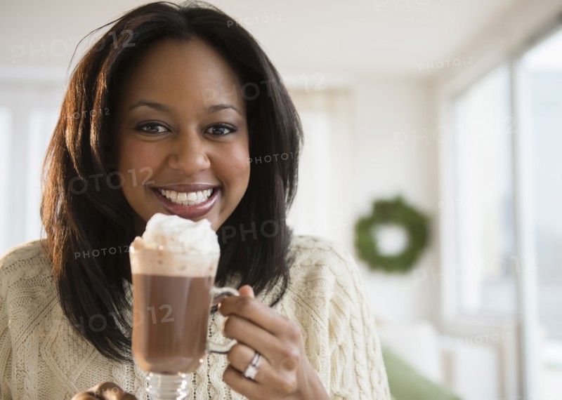 African American woman drinking hot chocolate