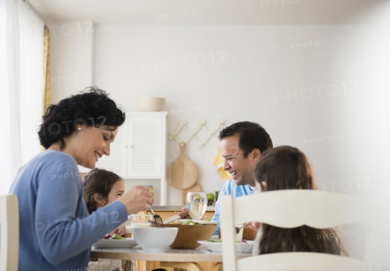 Family eating together at table