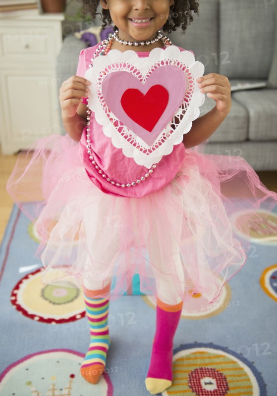African American girl holding Valentine's Day card