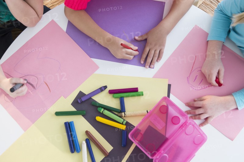 Girls coloring at desk