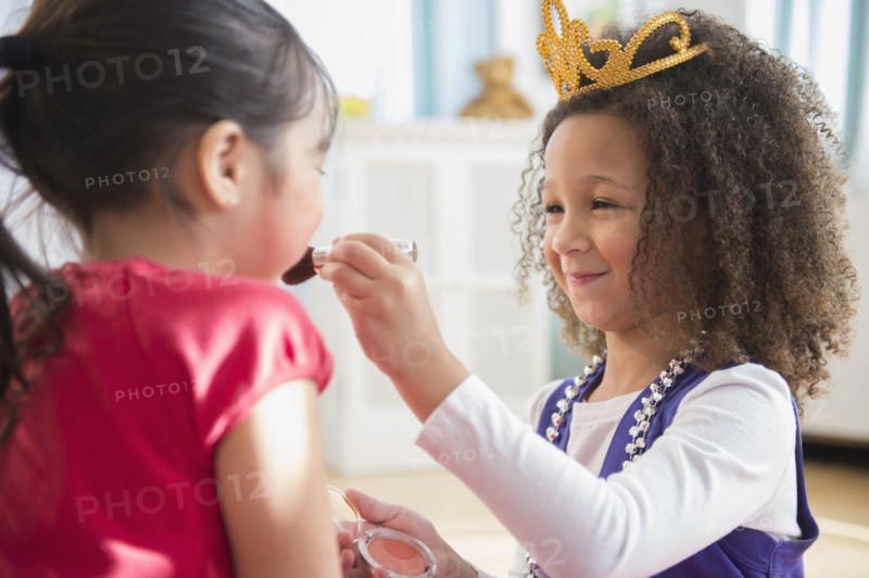 Girls playing dress up together