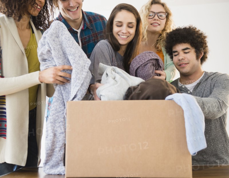 Friends packing boxes together