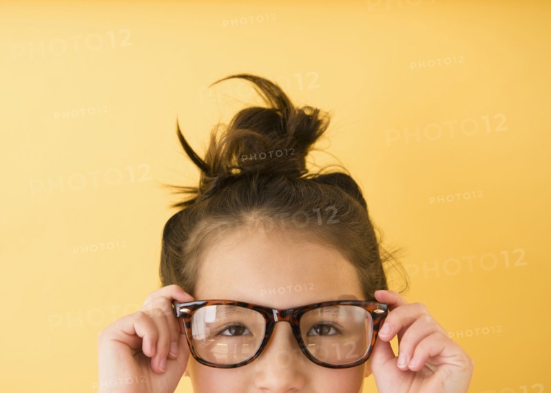 Mixed race girl wearing glasses