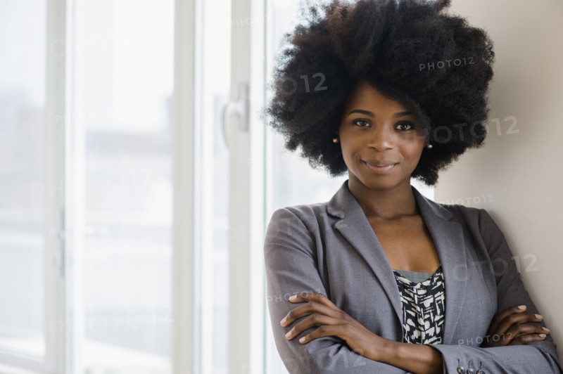 Mixed race businesswoman smiling