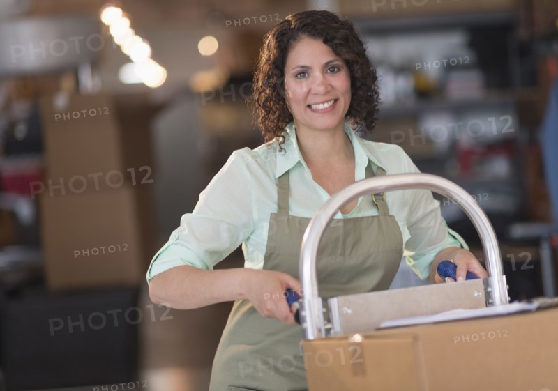 Hispanic woman working in warehouse