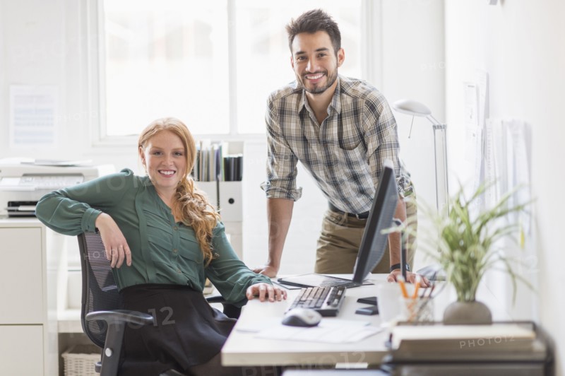 Business people smiling together in office