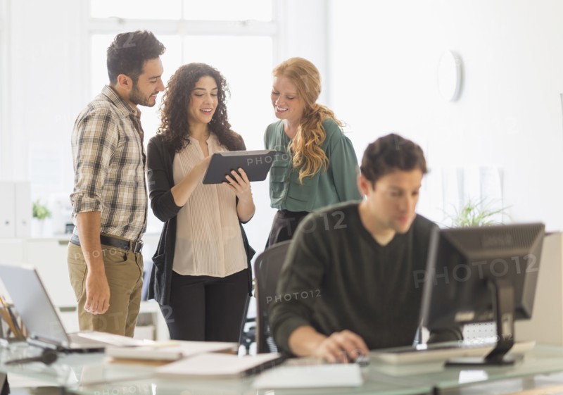 Business people using digital tablet in office