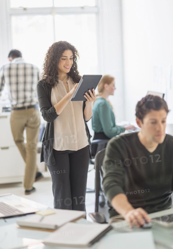 Businesswoman using digital tablet in office