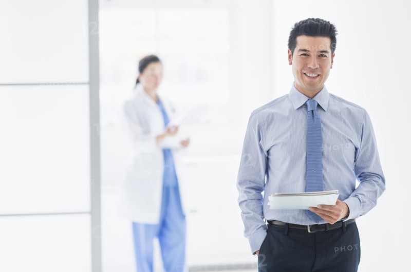 Businessman smiling in hospital