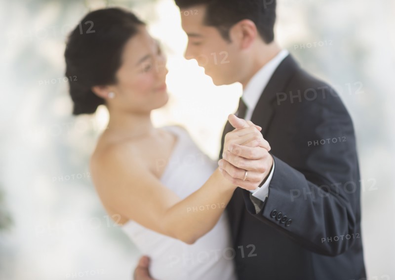Newlywed couple dancing at wedding reception
