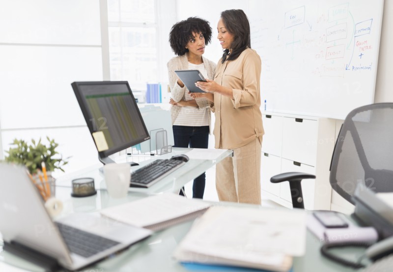 African American businesswomen working in office