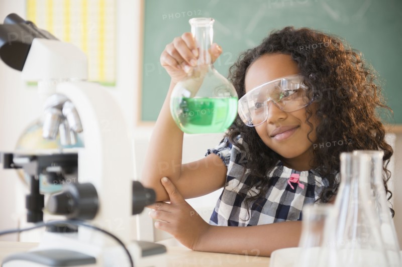 Mixed race student working in chemistry lab