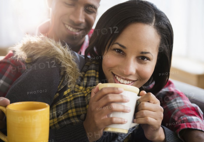 Portrait of happy couple drinking coffee